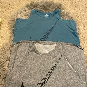2 womens Nike dri fit cotton tanks.